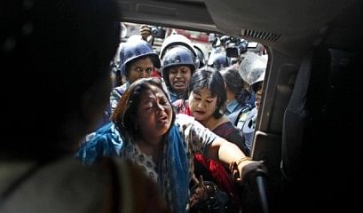 Four women lawmakers of BNP are being picked up on a police van after their arrest from in front of BNP headquarters at Nayapaltan. Photo: Rashed Sumon