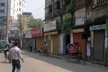 Roadside shops are seen closed while rickshaws remain idle at Zahaj Company intersection in Rangpur city during Wednesday’s shutdown enforced by Islami Chhatra Shibir, a student wing of Jamaat-e-Islami. Photo: STAR   