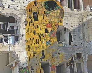 Tammam Azzam, a Syrian-born artist who lives and works in Dubai, digitally superimposed Gustav Klimt's “The Kiss” on a photograph of a bullet-ridden wall in an unidentified part of Syria. That image, titled “Freedom Graffiti”, has generated lot of interest on the online social media, with tens of thousands of people sharing it. “Freedom Graffiti” is part of a larger body of work Azzam produced in response to his country's struggle, titled “Syrian Museum”. The digital artworks play on other iconic paintings from artists such as da Vinci, Matisse and Picasso set against images of a Syria in ruins. 