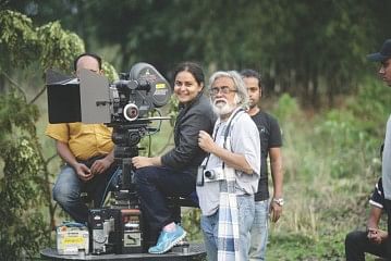 Afsana Mimi behind the camera, with cinematographer Anwar Hossain. 