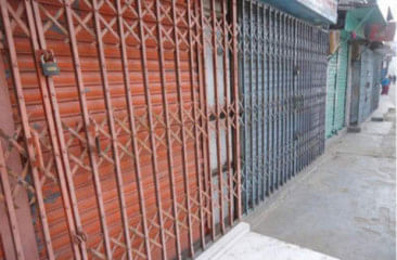 Shop owners keep shutters down during hartal (shutdown) hours fearing vandalism. Star file photo