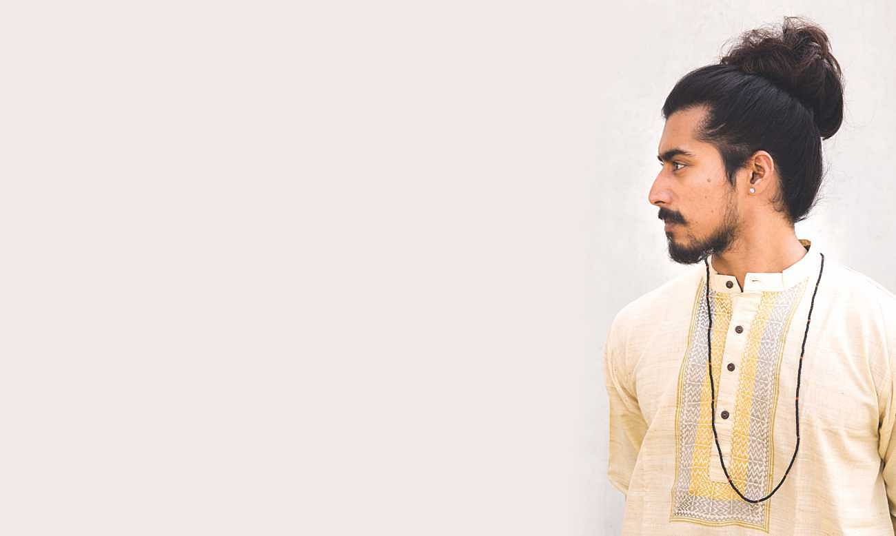 handsome bengali man with sleek hair and beard wearing kolkata traditional  dress