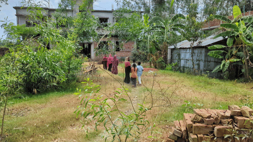 People gather in front of the family’s house as shock grips the area, leaving a heavy silence over the community after the news broke. Photo: Star