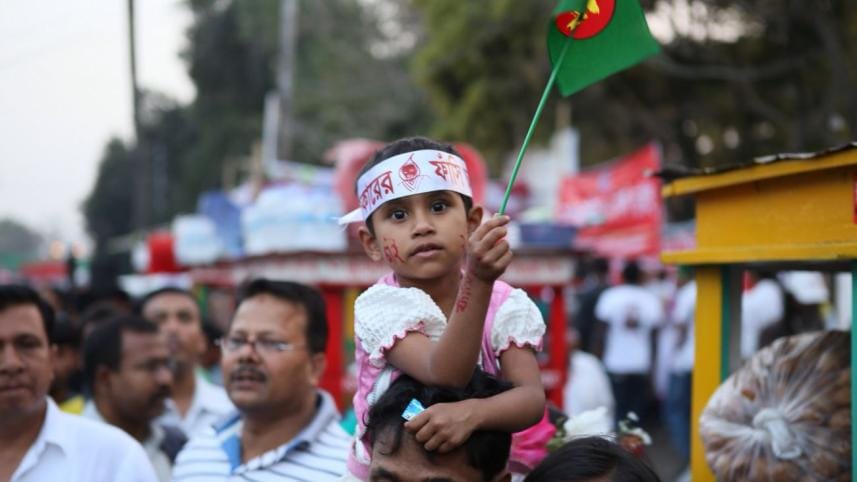 Bangladesh_girl_holding_national_flag