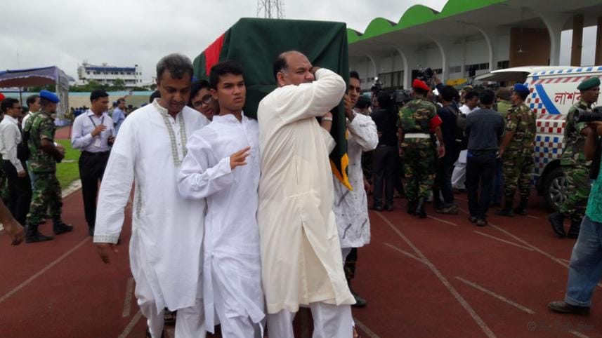 The body of Faraaz Ayaaz Hossain, who was brutally killed along with 19 other hostages in a militant attack at a Dhaka café last Friday, is being carried in a coffin by his family members after being handed over today at the Army Stadium. 