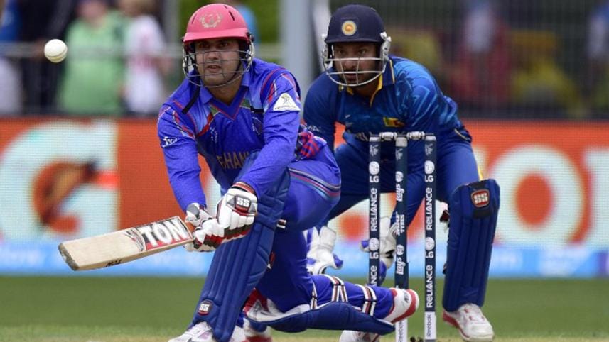 Afghanistan's captain Mohammad Nabi plays a shot 