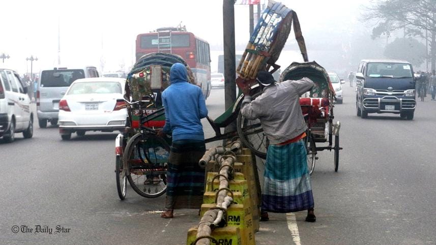 A rickshaw is being carried across