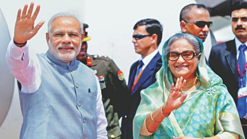 Prime Minister Sheikh Hasina welcoming Indian Prime Minister Narendra Modi to Bangladesh
