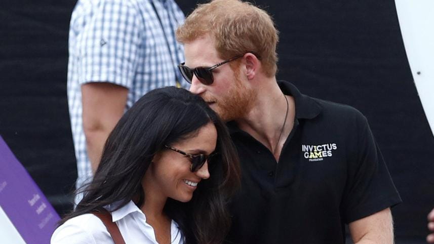 Britains Prince Harry arrives with girlfriend Meghan Markle