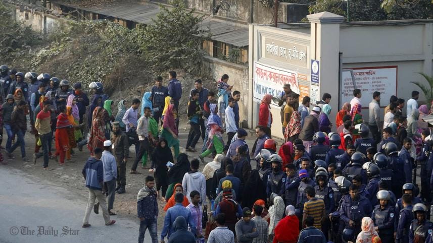 A large number of law enforcers are deployed in Ashulia as workers return to factories 