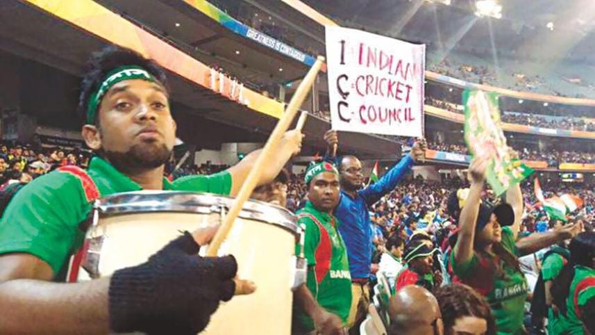 Bangladeshi fans in the gallery show a placard after controversial decisions ruined the second quarterfinal between Bangladesh and India at Melbourne Cricket Ground yesterday. Photo: Collected