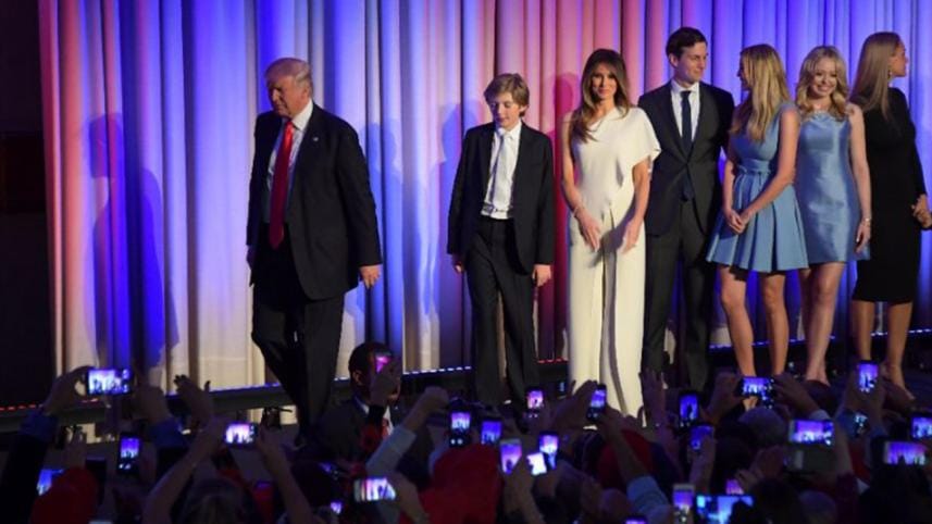 Donald Trump walking with his family