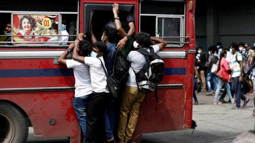 Sri Lankan students hanging from bus