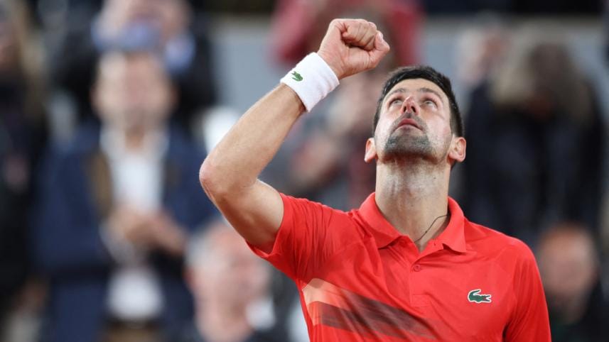  Novak Djokovic celebrates after winning his first round match against Japan's Yoshihito Nishioka.