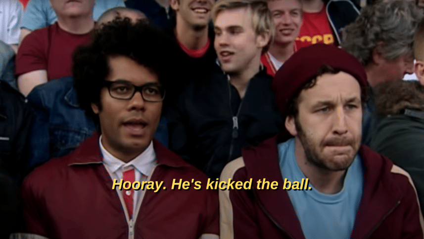 Photo of Richard Ayoade as Moss saying "Hooray. He's kicked the ball."