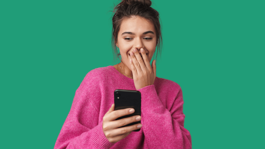 Woman laughing at her phone