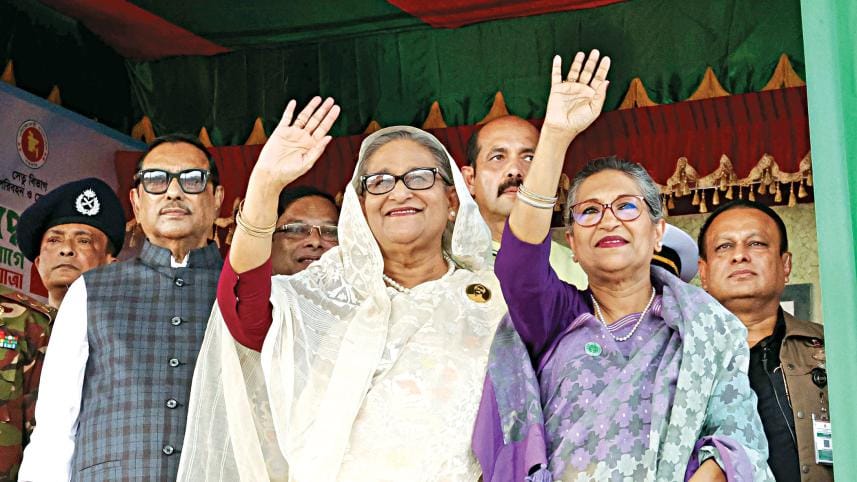 Prime Minister Sheikh Hasina flanked by her younger sister Sheikh Rehana and Road Transport and Bridges Minister Obaidul Quader at a rally on the former trade fair ground at Sher-e-Bangla Nagar after the prime minister inaugurated the country’s first elev