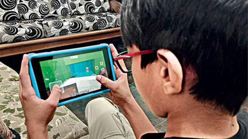 Ten-year-old Adnan Ahmed Aman's playing Minecraft