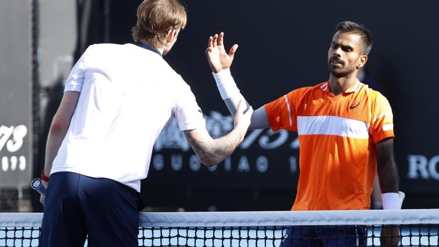 India's Sumit Nagal shakes hands with Kazakhstan's Alexander Bublik after winning his first round match. 