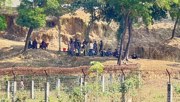 Members of the Border Guard Police of Myanmar take refuge at a Border Guard Bangladesh outpost in Ghumdhum of Bandarban yesterday. 