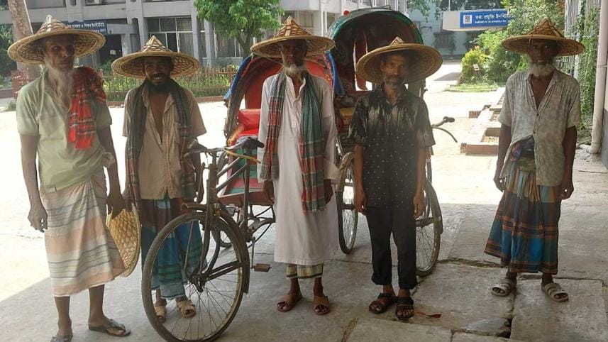 Rickshaw-pullers smile wearing custom made mathals (lightweight bamboo leaf hats), which ensure both comfort and protection from sunlight.