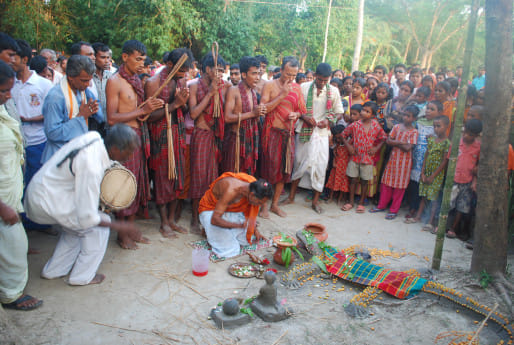 Locals perform the ritual of Charak Puja.jpg