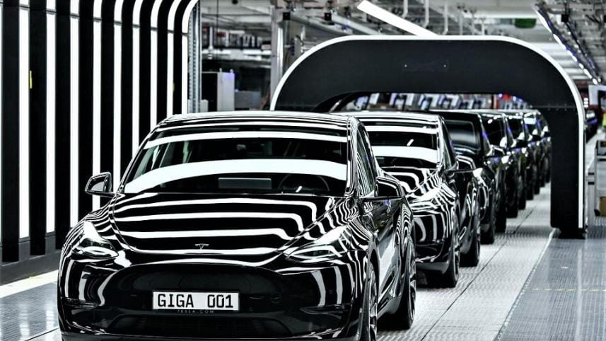 Tesla slashes price.jpg