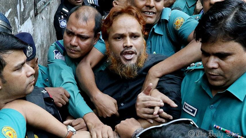 a_convict_in_the_holey_artisan_cafe_attack_case_is_being_taken_to_the_prison_van_amid_high_security._photo-anisur_rahman_star.jpg