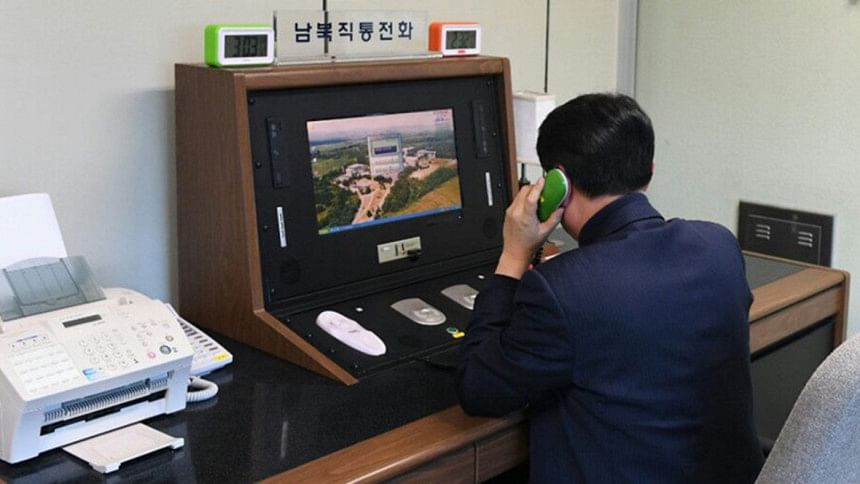A South Korean government official checks the direct communications hotline A South Korean government official checks the direct communications hotline
