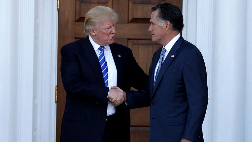 US President-elect Donald Trump shakes hands with former Massachusetts Governor Mitt Romney US President-elect Donald Trump shakes hands with former Massachusetts Governor Mitt Romney