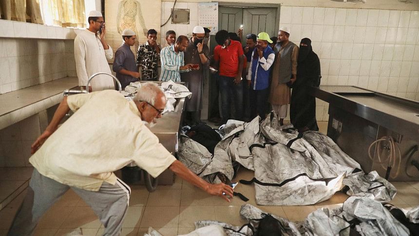 Relatives of victims of a fire incident attempt to identify the bodies at Dhaka Medical College Hospital Relatives of victims of a fire incident attempt to identify the bodies at Dhaka Medical College Hospital