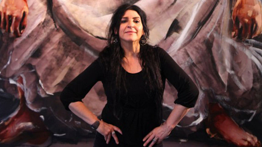 Artist Lita Cabellut standing in front of 'Frida 8'