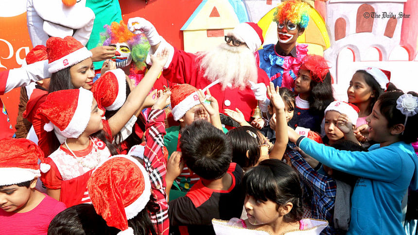 Santa Claus handing out candies Santa Claus handing out candies