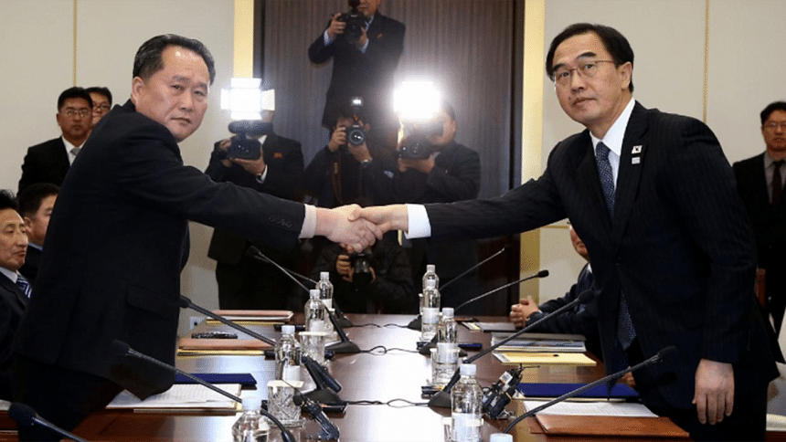 Ri Son Gwon shakes hands with Cho Myoung-gyon Ri Son Gwon shakes hands with Cho Myoung-gyon