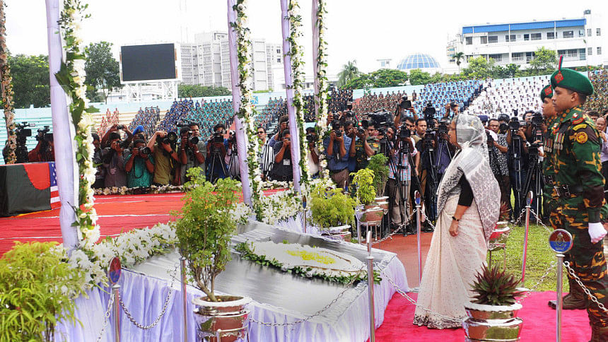 Prime Minister Sheikh Hasina talks to the family members of the victims of Gulshan attack after paying homage by placing wreaths on their coffins at the Army Stadium. Prime Minister Sheikh Hasina talks to the family members of the victims of Gulshan attack