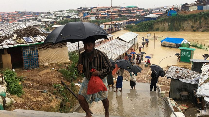 Rohingya refugees walks along the refugee camp Rohingya refugees walks along the refugee camp