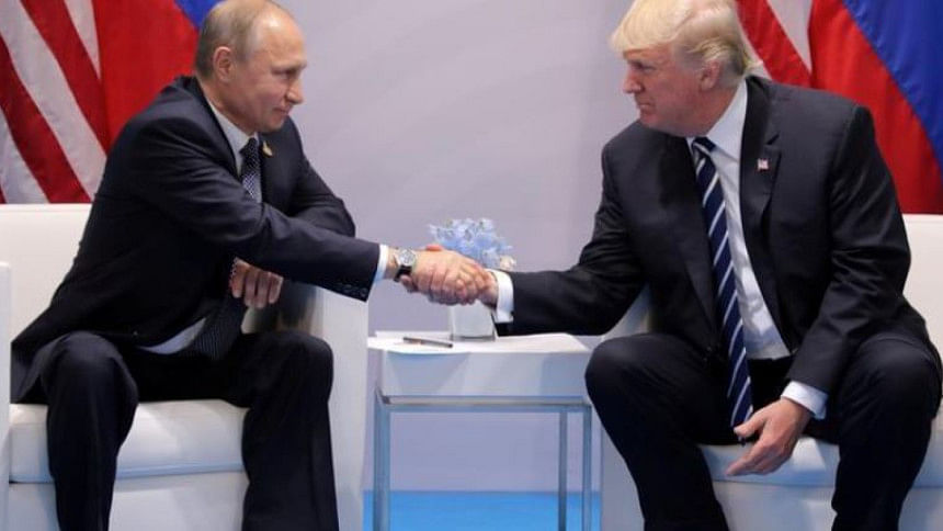 US President Donald Trump shakes hands with Russia's President Vladimir Putin US President Donald Trump shakes hands with Russia's President Vladimir Putin