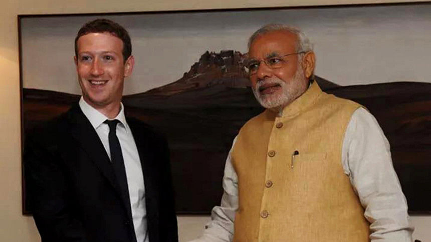 Facebook's Mark Zuckerberg shakes hand with India PM Narendra Modi.