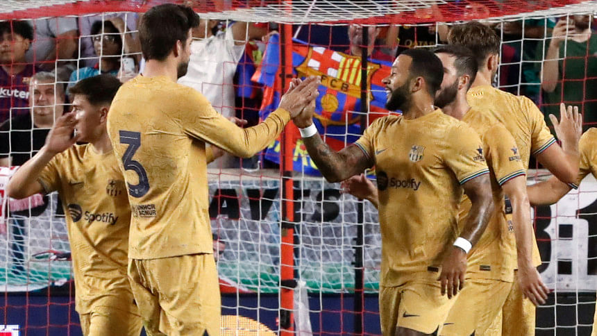 Barcelona's Dutch forward Memphis Depay (R) celebrates with teammates after scoring a goal during the international friendly football match between the New York Red Bulls and FC Barcelona at Red Bull Arena in Harrison, New Jersey Barcelona's Dutch forward Memphis Depay (R) celebrates with teammates after scoring a goal during the international friendly football match between the New York Red Bulls and FC Barcelona at Red Bull Arena in Harrison, New Jersey