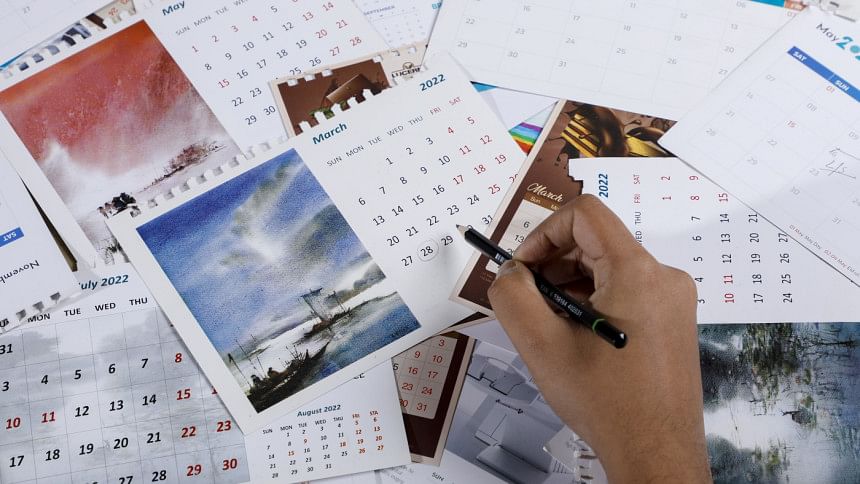 Student scribbling on calendars in a futile attempt to sort out their academic plans.