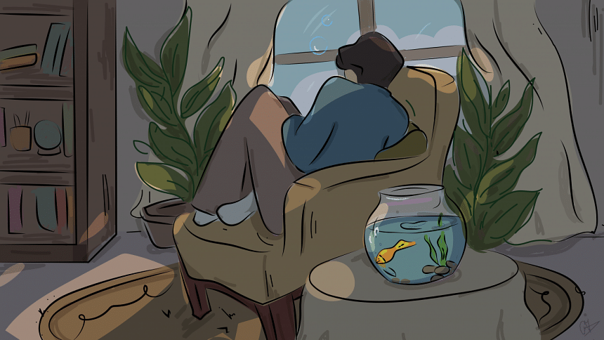 Boy curled up on a couch.