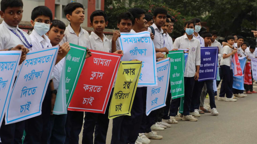 Students, teachers form human chains demanding timely exams, safe environment