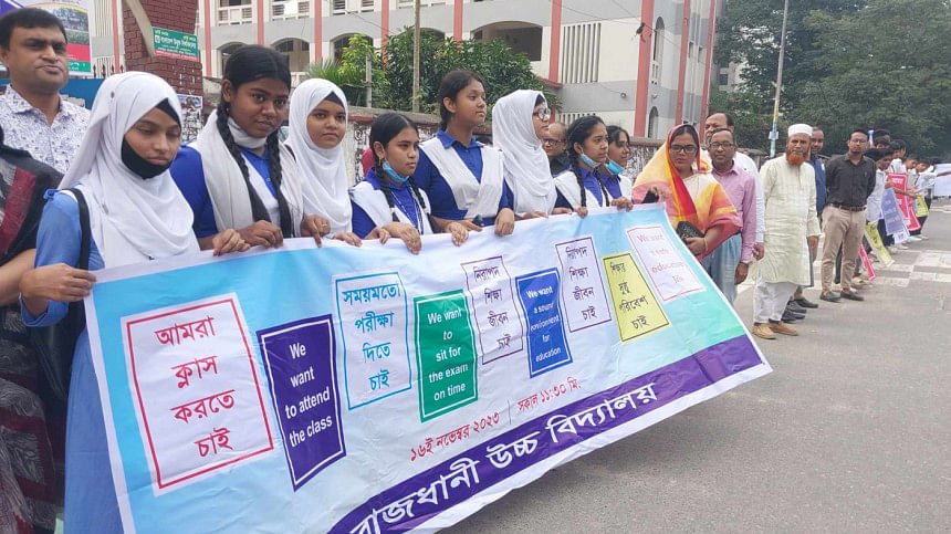 Students, teachers form human chains demanding timely exams, safe environment