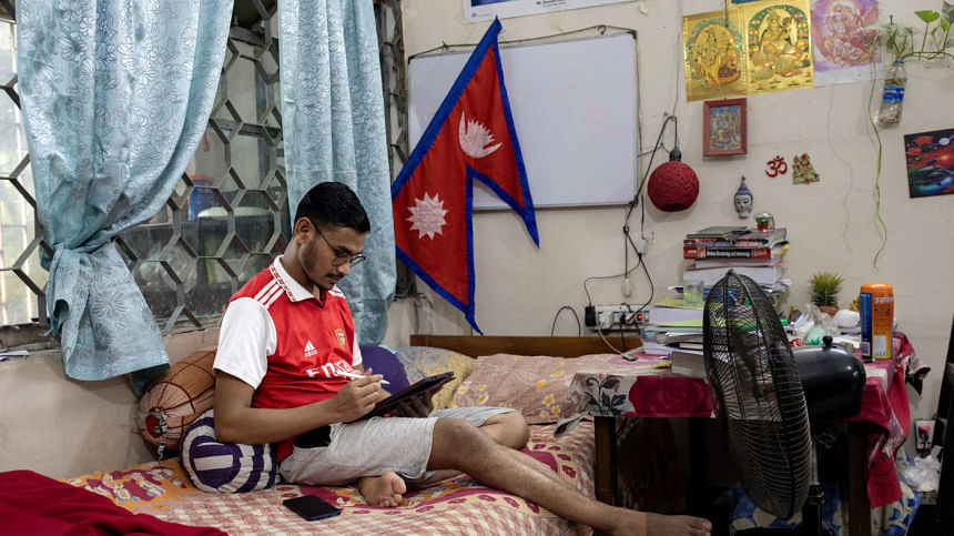 International medical student studying in his room International medical student studying in his room