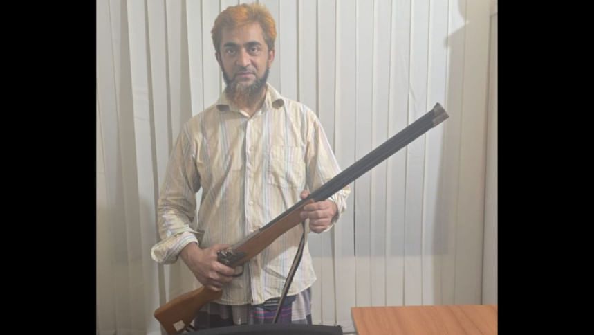 Man held for brandishing ‘dummy rifle’ in procession