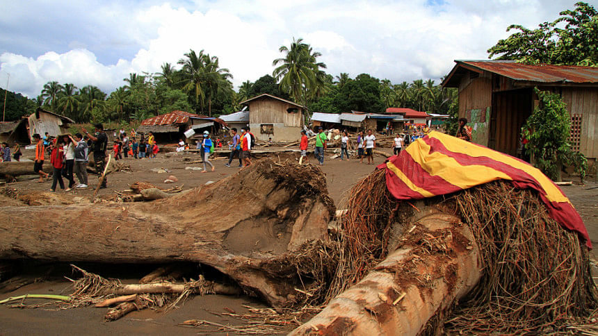 Philippine storm death toll rises to 200 Rescuers search for Philippine storm victims as toll rises to 200