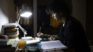 A person studying late at night