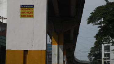Stickers calling for advertisements are now seen on the pillars of the elevated expressway in Chattogram. Photo: Star