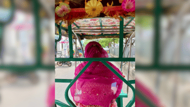 This brave mother takes the wheel on the roads of Dhaka