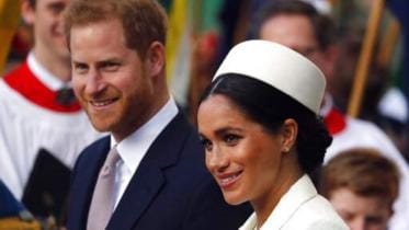 Britain’s Prince Harry and his wife Meghan